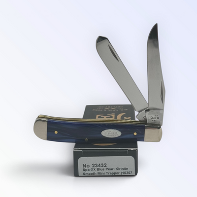 Case XX Blue Pearl Kirinite Mini Trapper with SKU 23432 — blades open resting on the factory box