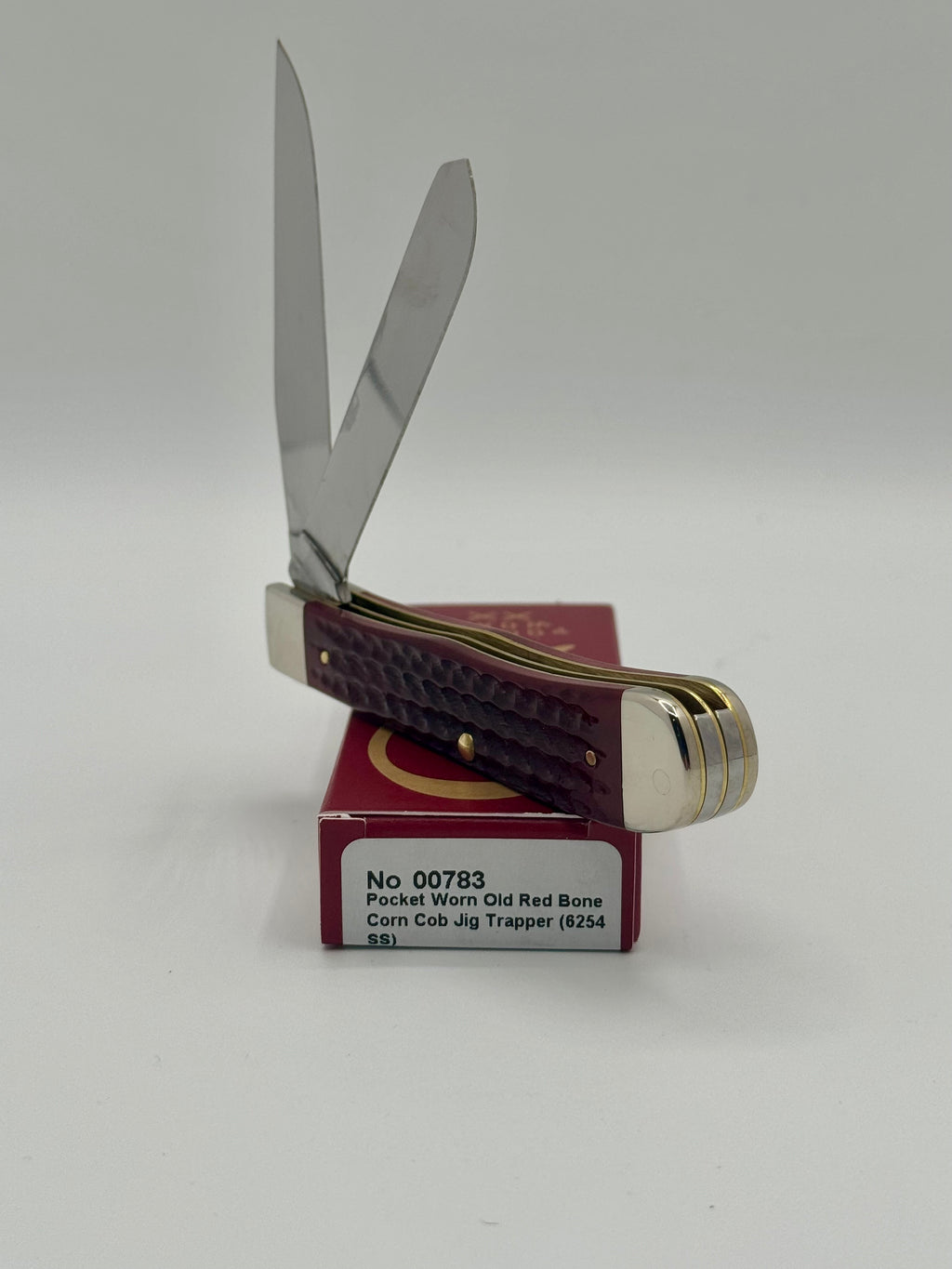 Case XX 00783 Pocket Worn Red Bone Trapper — handle and shield detail