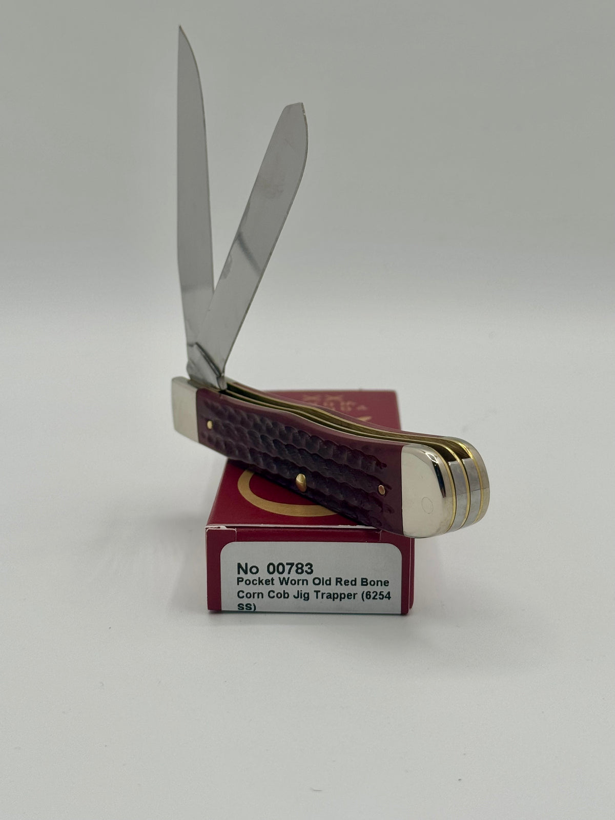 Case XX 00783 Pocket Worn Red Bone Trapper — handle and shield detail