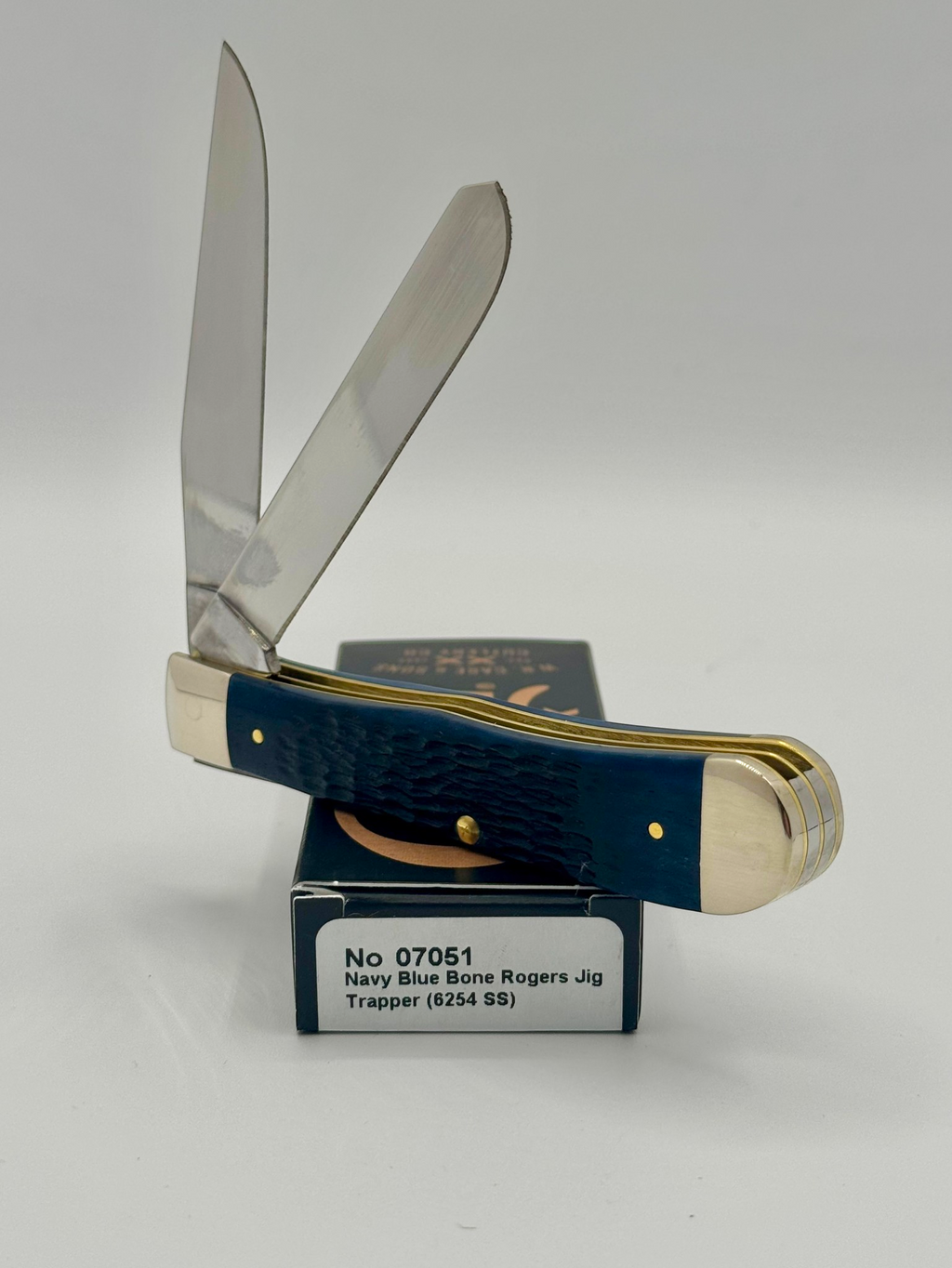 Case XX 07051 Navy Blue Bone Trapper — handle and shield detail