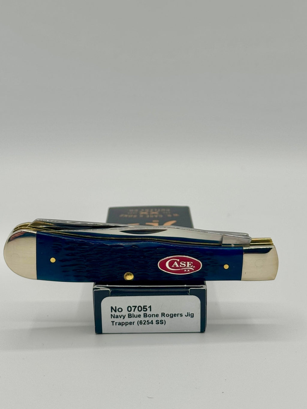 Case XX 07051 Navy Blue Bone Trapper — lifestyle angle on Case box