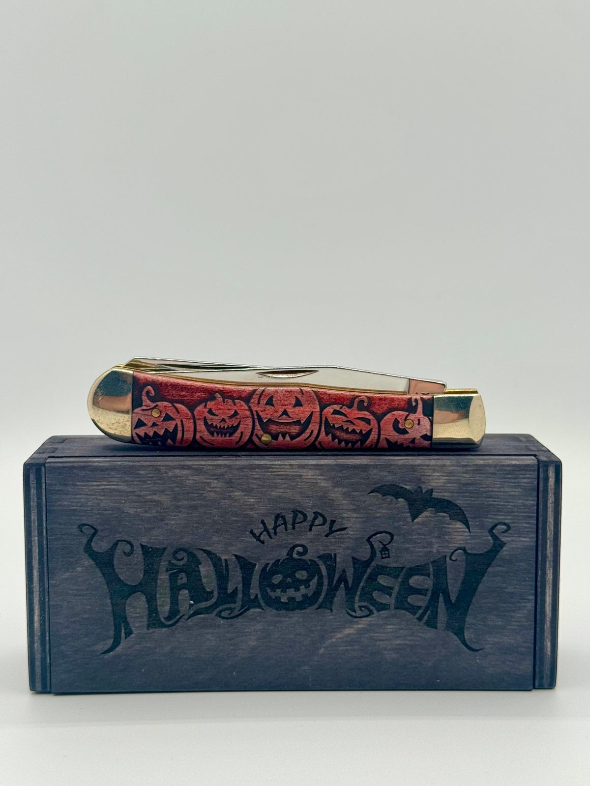 Case XX 10614 Halloween Color Wash Orange Trapper — lifestyle angle on Case box