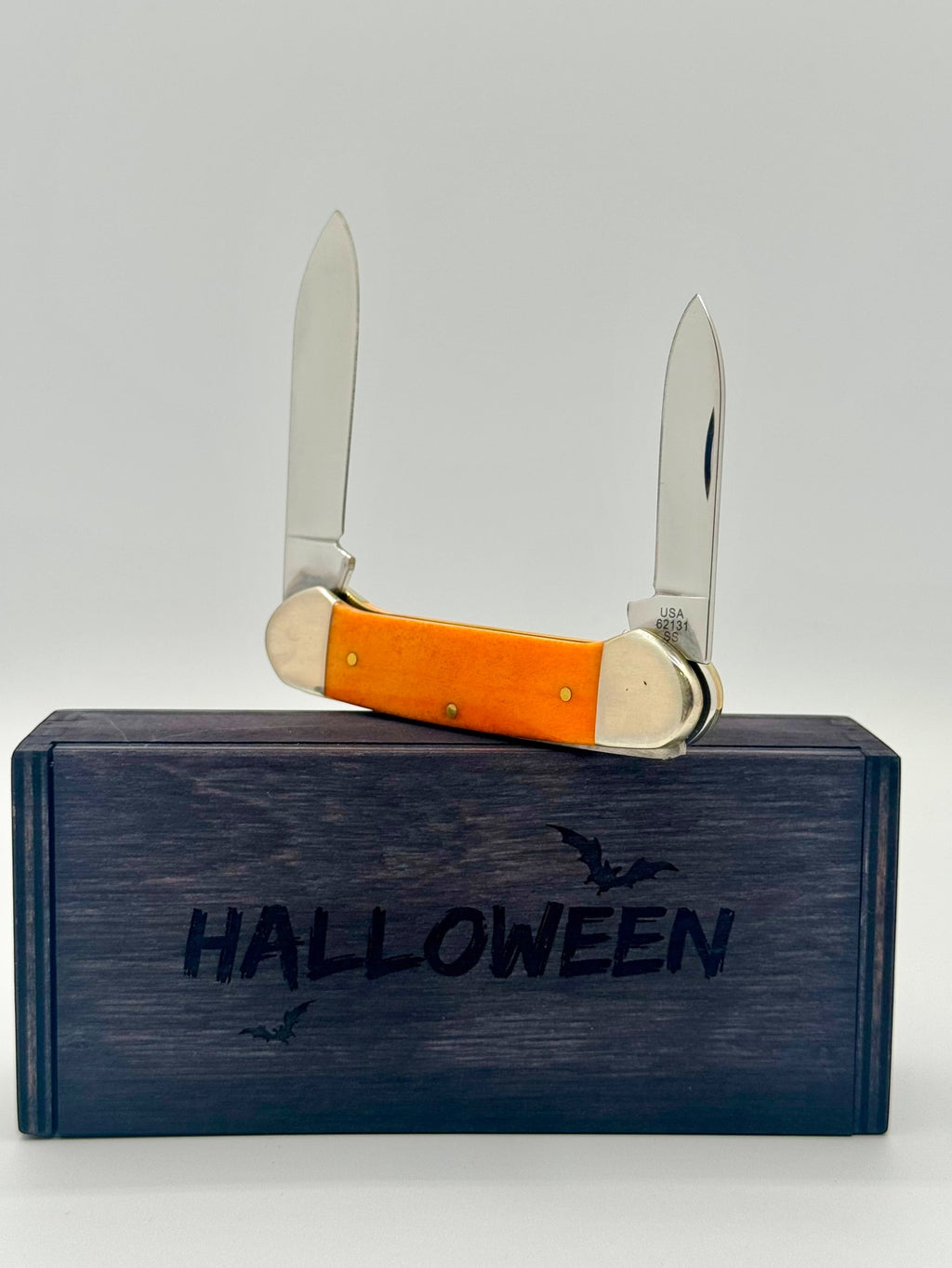 Case XX 10626 Halloween Persimmon Orange Bone Canoe — handle and shield detail