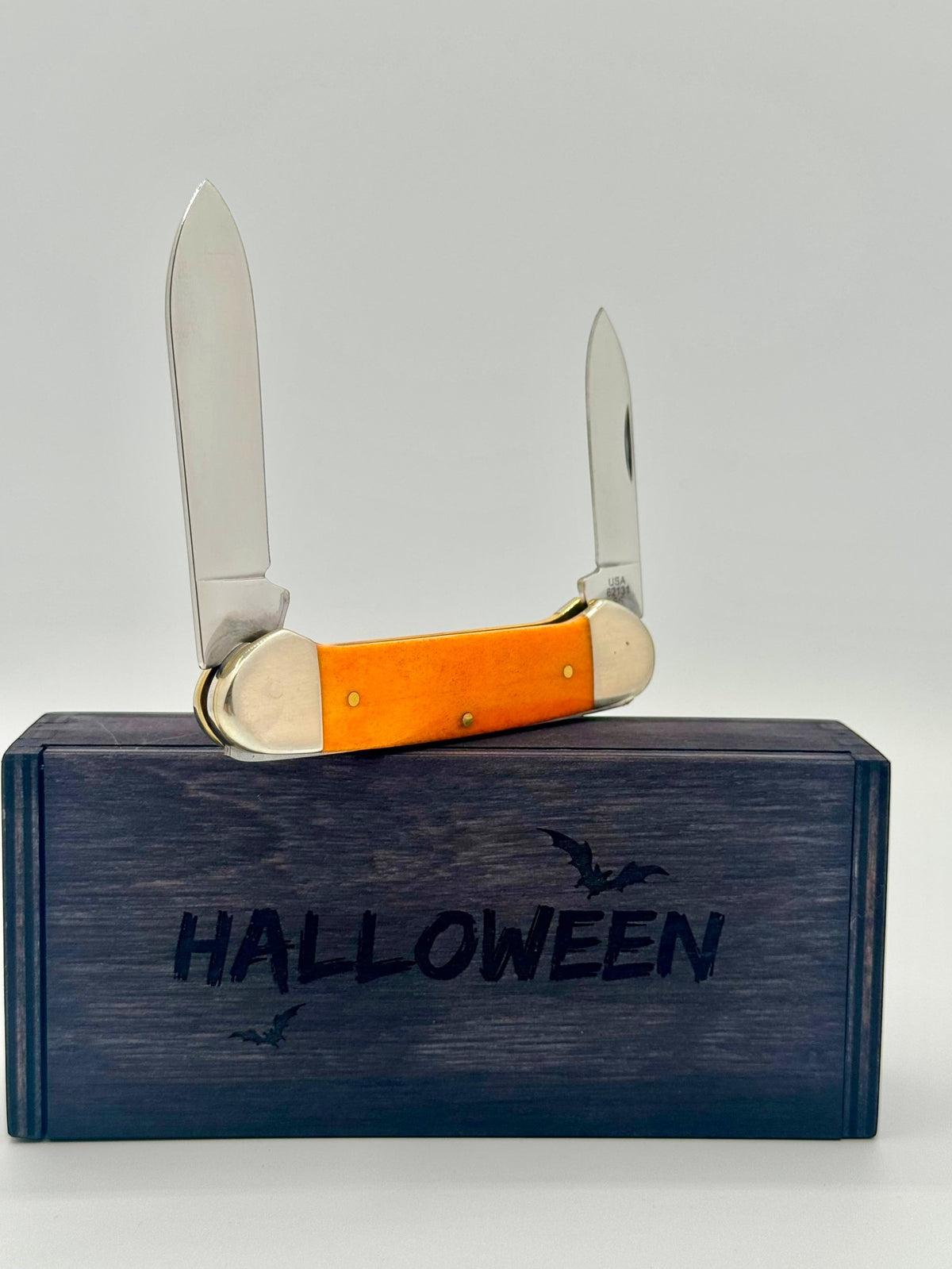 Case XX 10626 Halloween Persimmon Orange Bone Canoe — back side on Case box