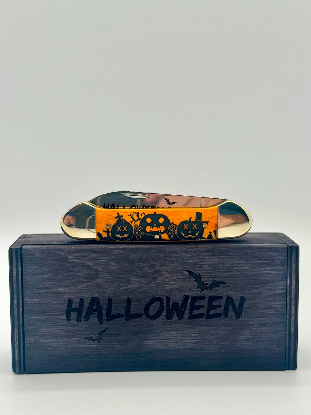 Case XX 10626 Halloween Persimmon Orange Bone Canoe — lifestyle angle on Case box