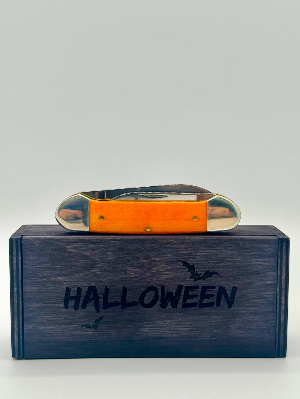 Case XX 10626 Halloween Persimmon Orange Bone Canoe — packaging and knife together