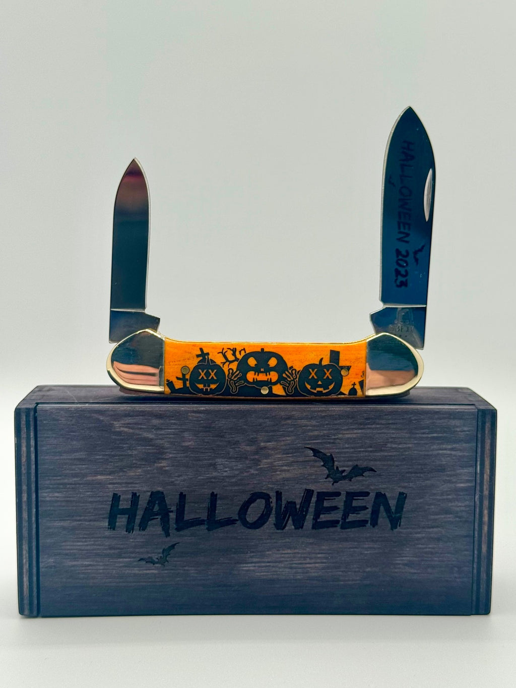 Case XX 10626 Halloween Persimmon Orange Bone Canoe — open on Case retail box