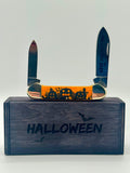 Case XX 10626 Halloween Persimmon Orange Bone Canoe — open on Case retail box