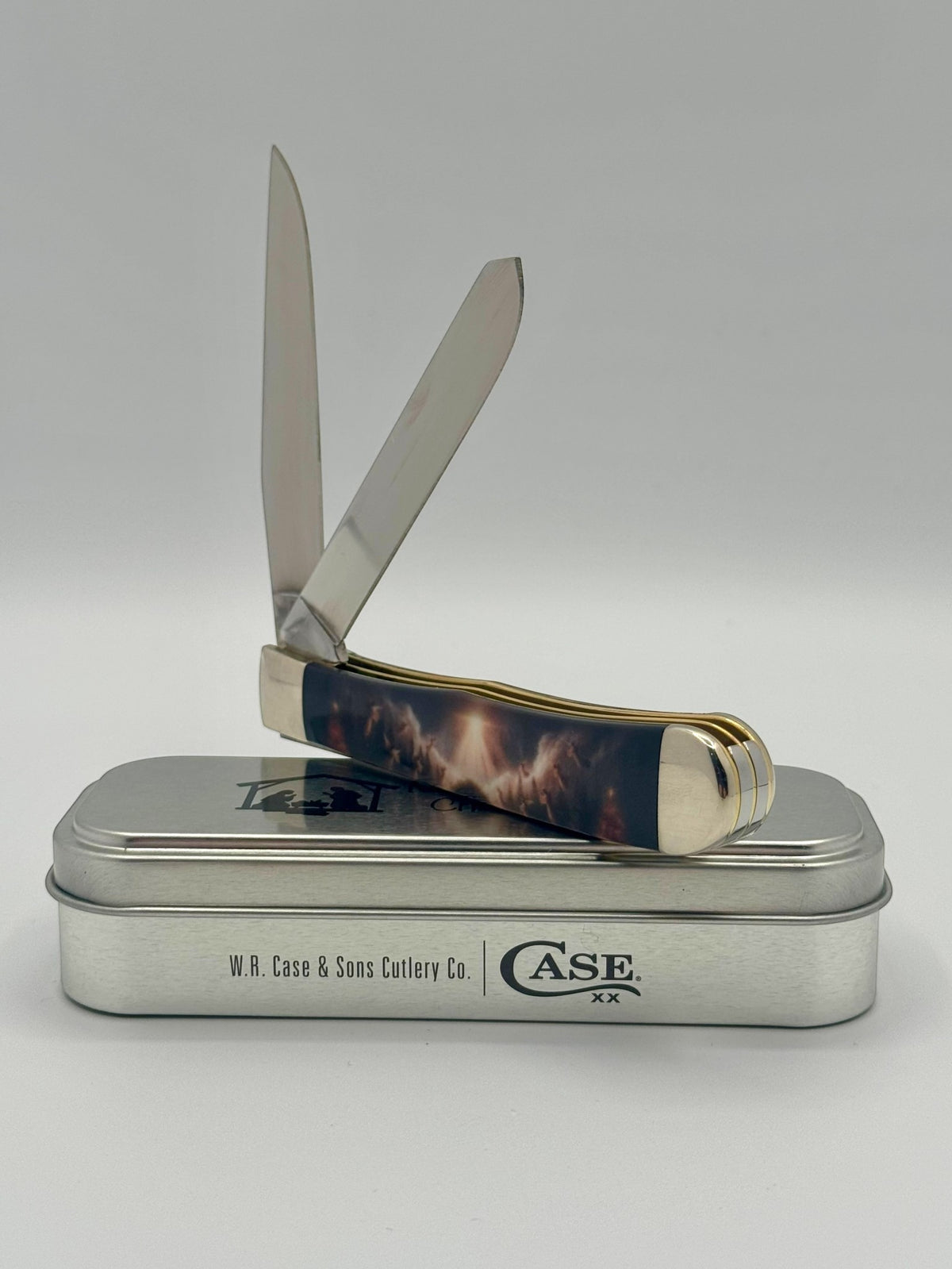 Case XX 10643 2025 Christmas CCI White Synthetic Trapper — handle and shield detail