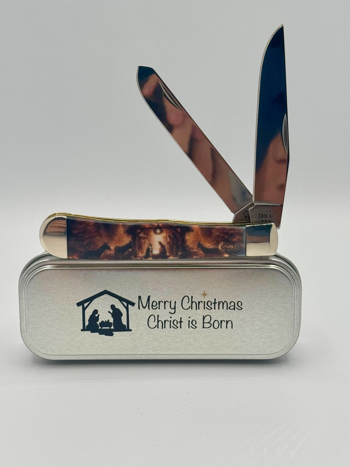 Case XX 10643 2025 Christmas CCI White Synthetic Trapper — open on Case retail box