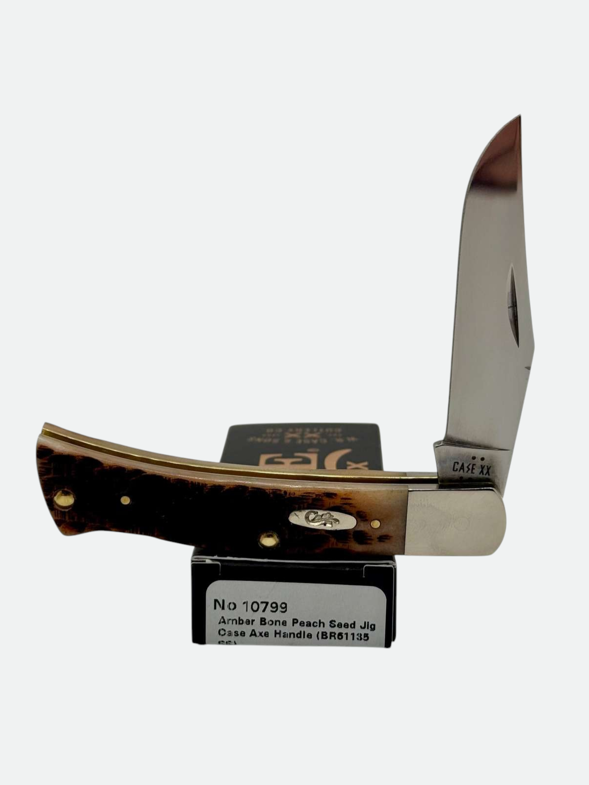 Pigeon Roost Knives Case XX Axe Handle pocket knife with amber bone peach seed jig scales and a clip blade