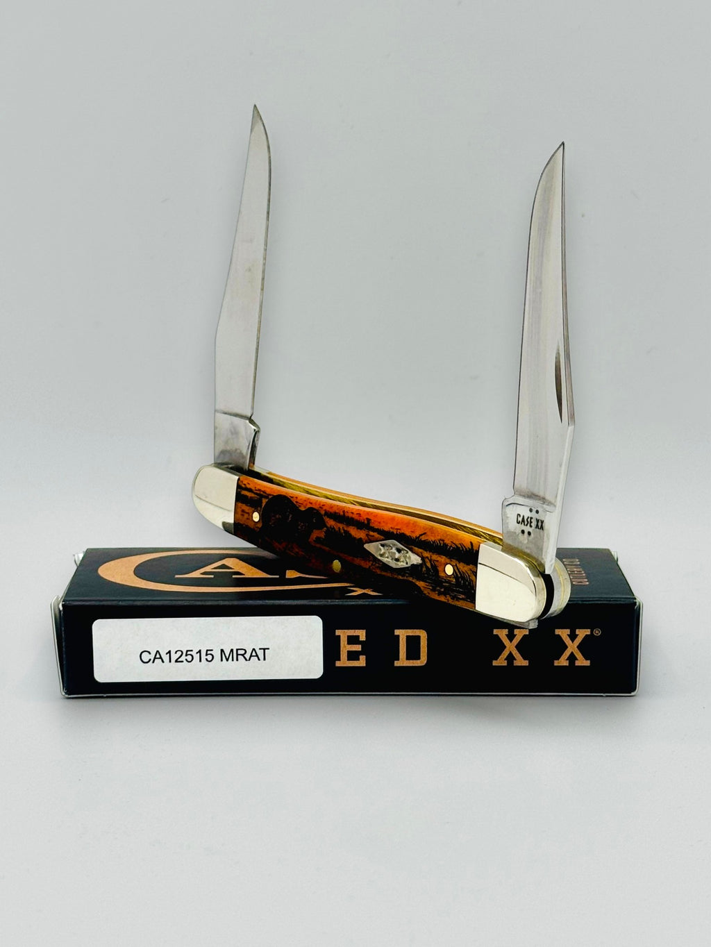 Case XX 12517MRAT Muskrat Engraving Red Bone — open on Case box
