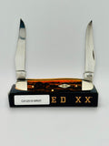 Case XX 12517MRAT Muskrat Engraving Red Bone — closed on Case box