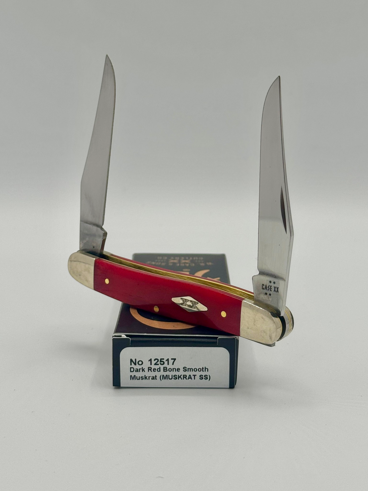 Case XX 12517 Smooth Red Bone Muskrat — closed on Case box