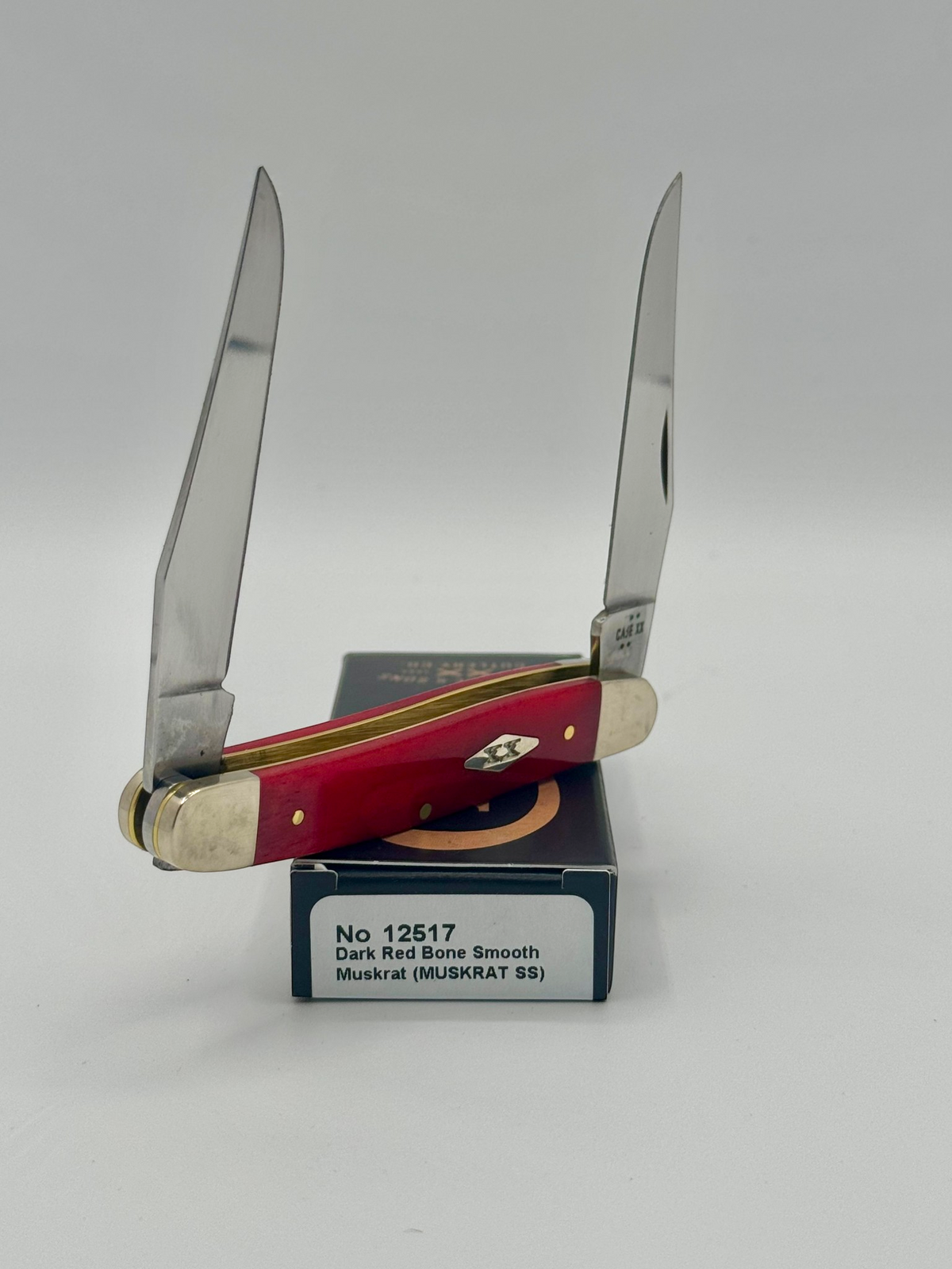 Case XX 12517 Smooth Red Bone Muskrat — blade detail on Case box