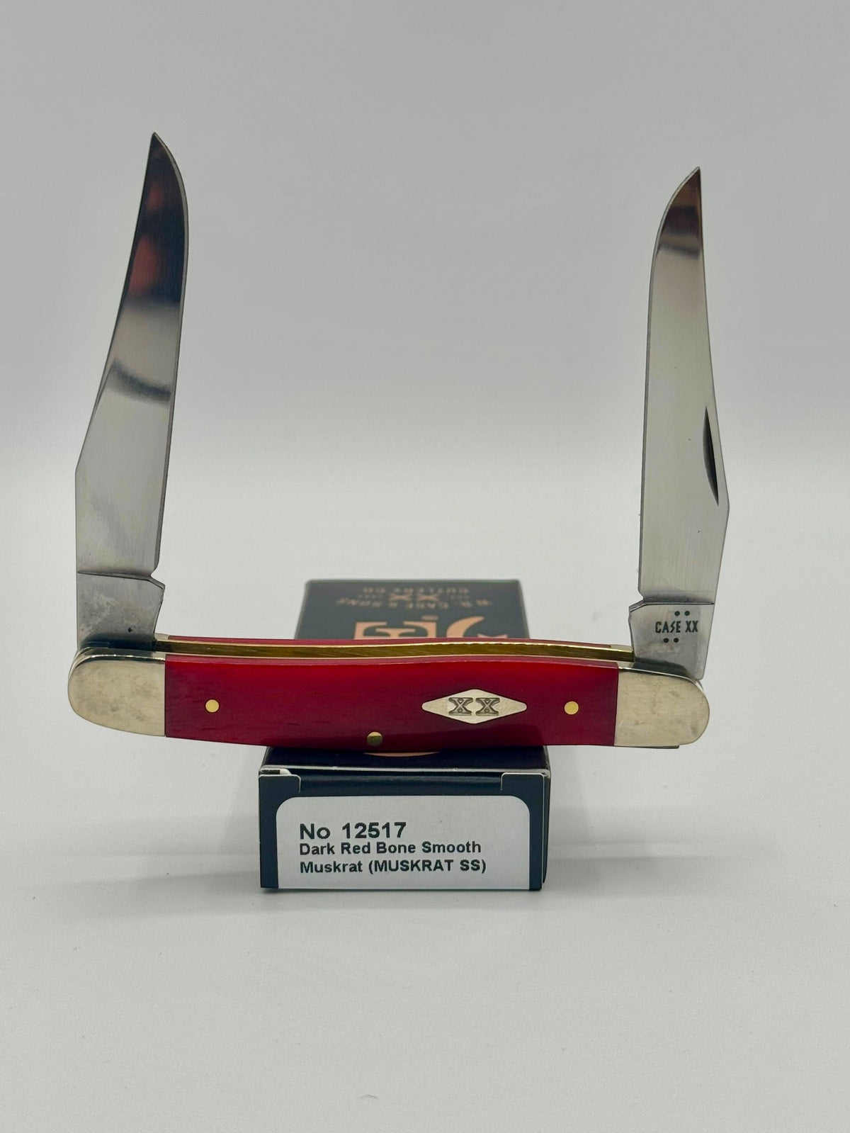Case XX 12517 Smooth Red Bone Muskrat — open on Case retail box