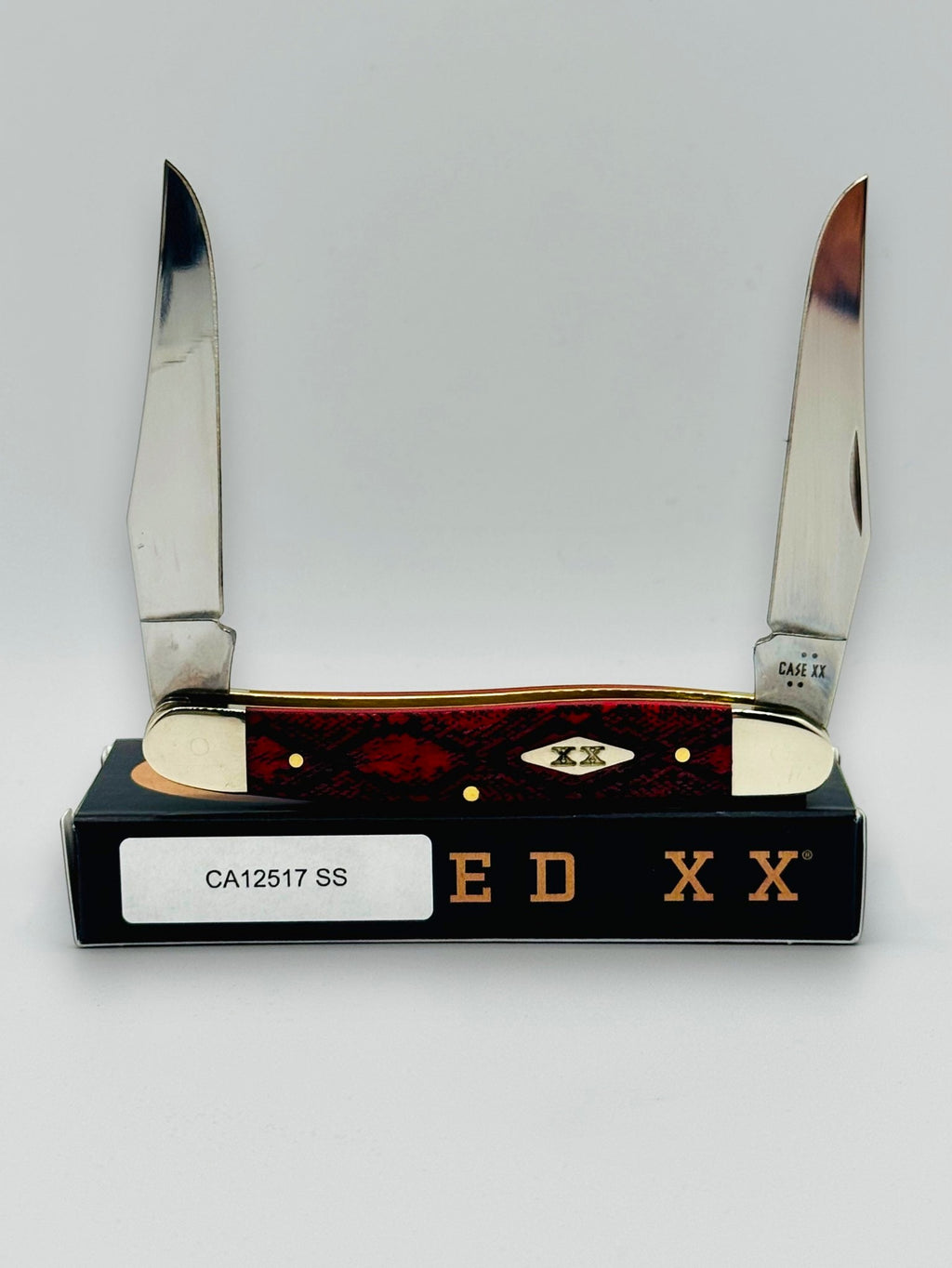 Case XX 12517SS Muskrat Snake Skin Red Bone — open on Case box