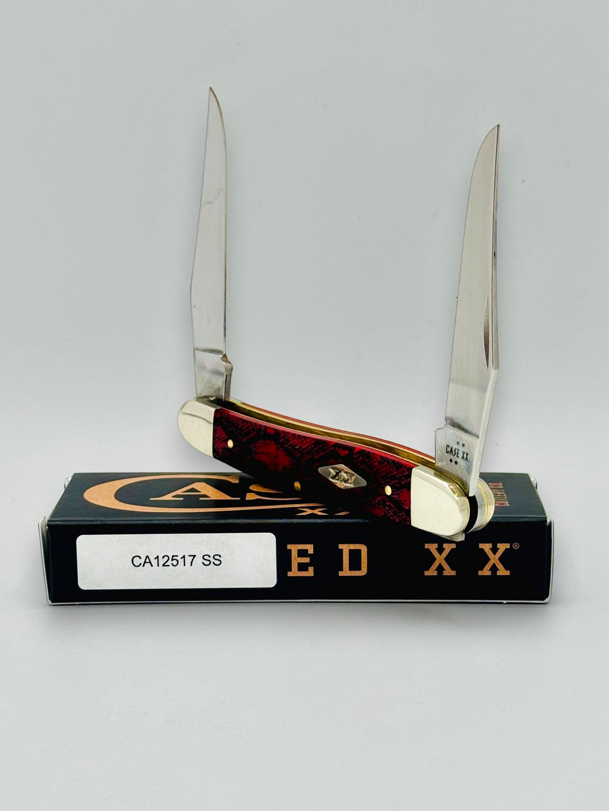 Case XX 12517SS Muskrat Snake Skin Red Bone — open blades front