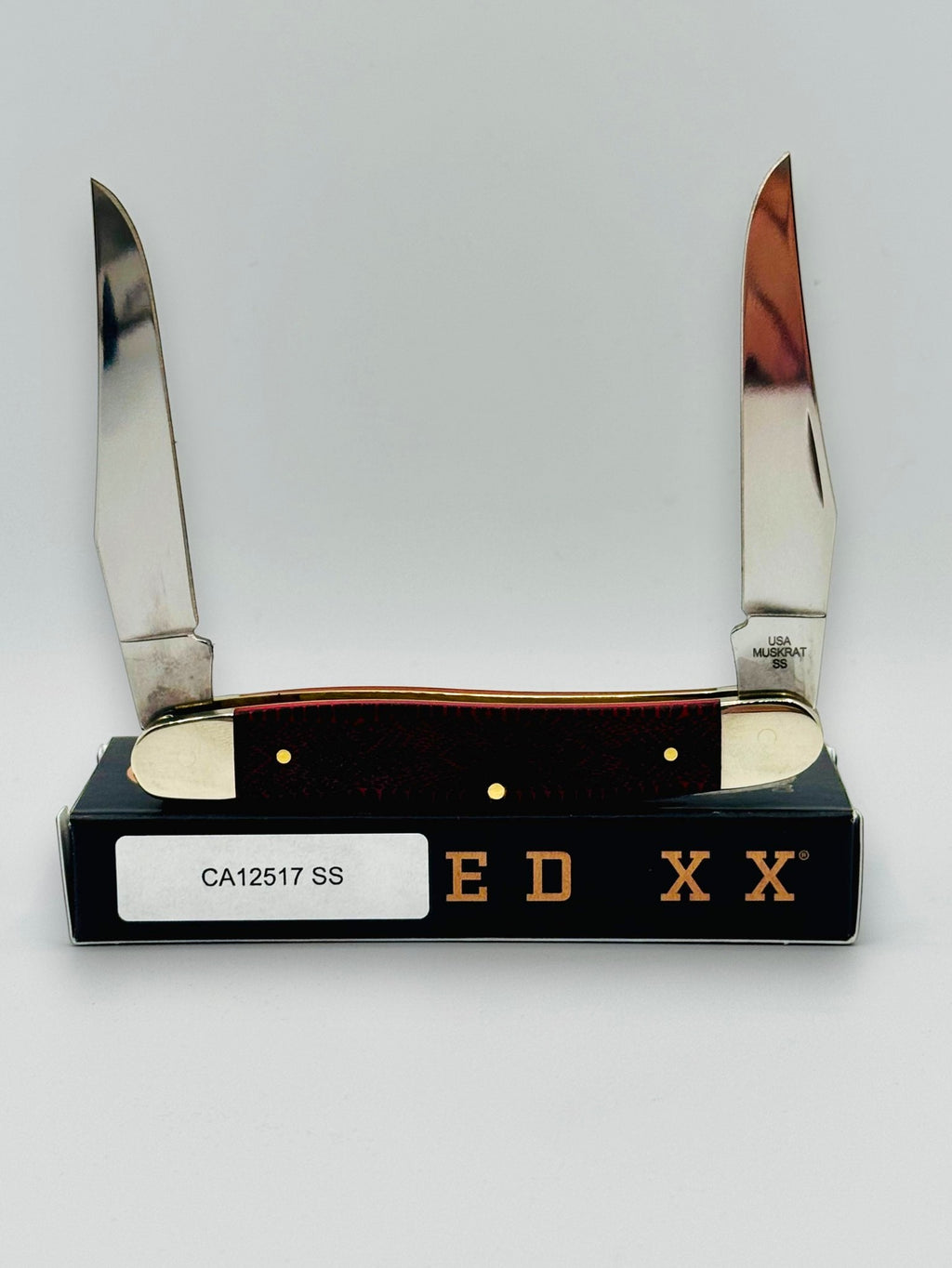 Case XX 12517SS Muskrat Snake Skin Red Bone — open showing Muskrat tang stamp