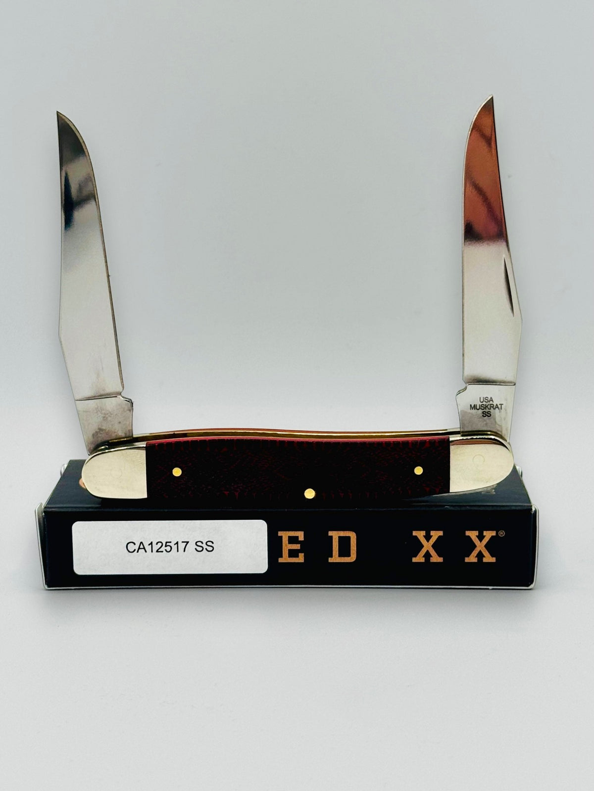 Case XX 12517SS Muskrat Snake Skin Red Bone — open showing Muskrat tang stamp