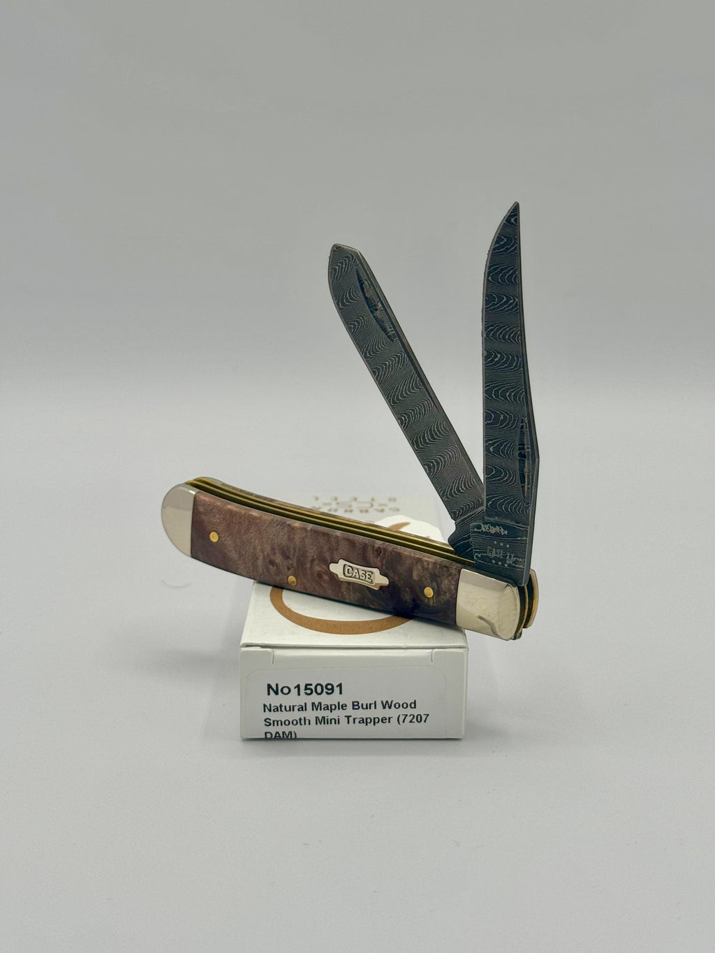 Case XX 15091 Natural Maple Burl Wood Ladder Damascus Mini Trapper — closed on Case box