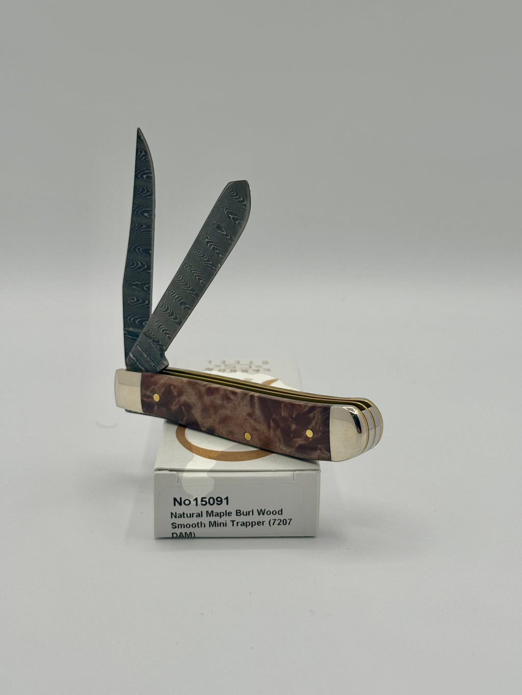Case XX 15091 Natural Maple Burl Wood Ladder Damascus Mini Trapper — handle and shield detail