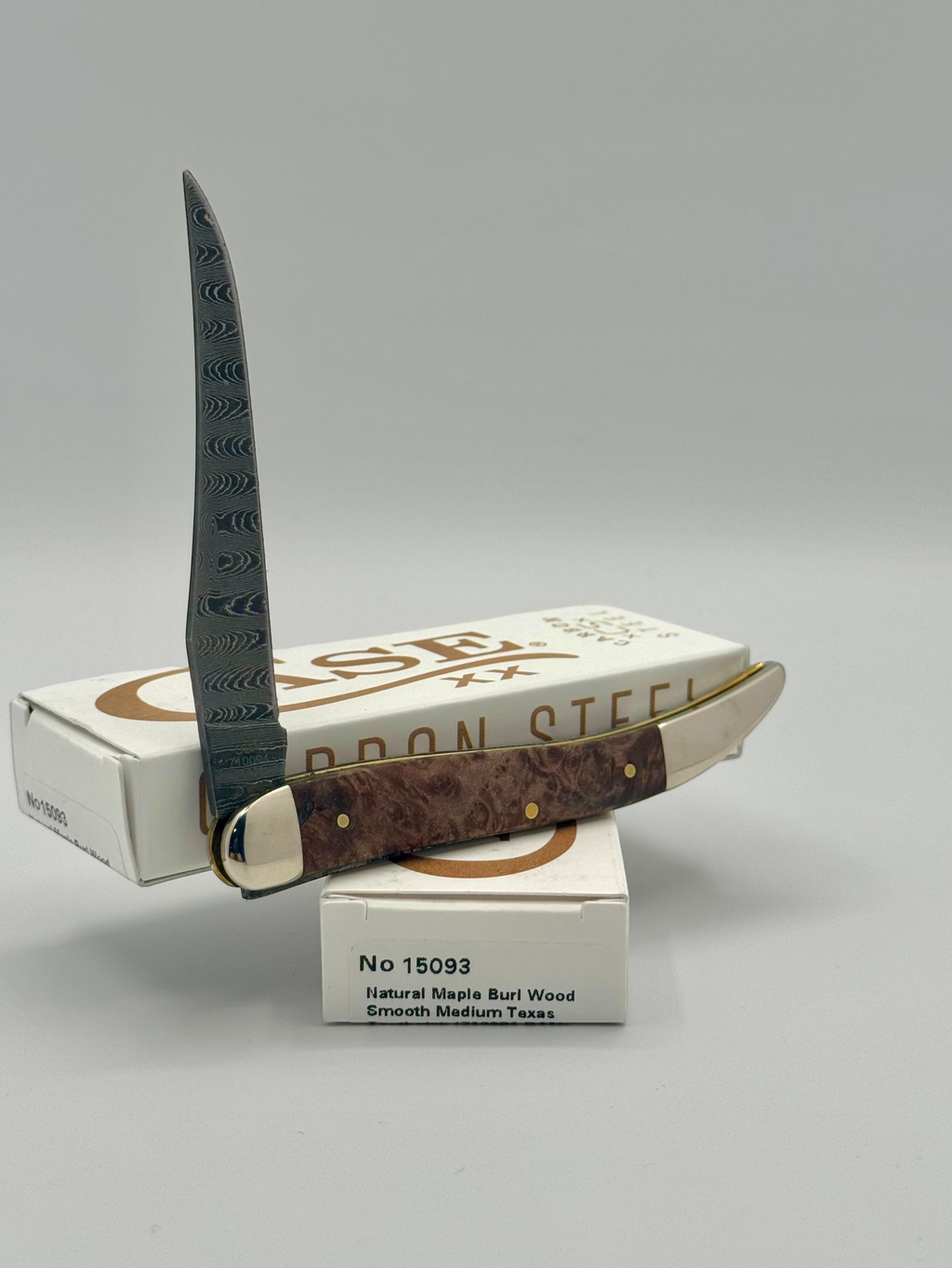 Case XX 15093 Smooth Natural Maple Burl Wood Damascus Medium Toothpick — back side on Case box