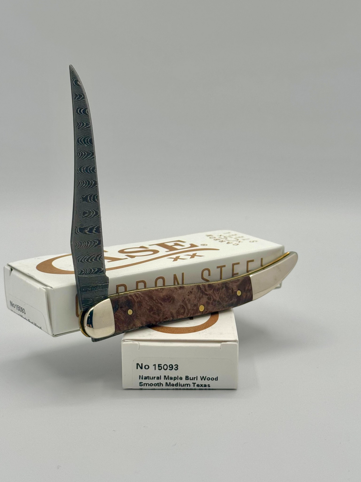 Case XX 15093 Smooth Natural Maple Burl Wood Damascus Medium Toothpick — back side on Case box