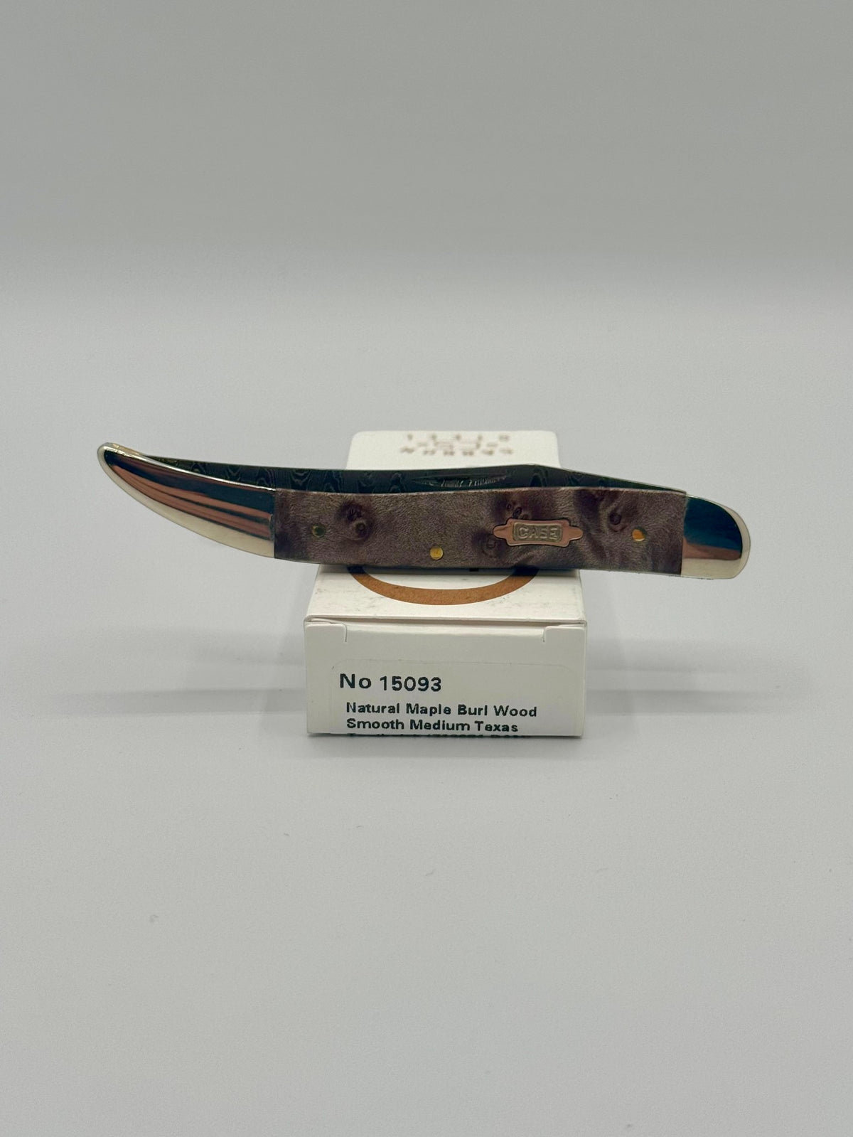 Case XX 15093 Smooth Natural Maple Burl Wood Damascus Medium Toothpick — lifestyle angle on Case box