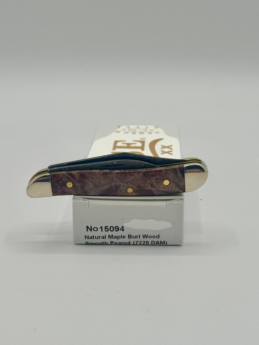 Case XX 15094 Smooth Natural Maple Burl Wood Damascus Peanut — packaging and knife together