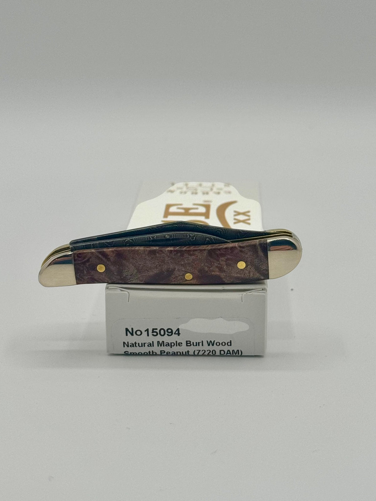 Case XX 15094 Smooth Natural Maple Burl Wood Damascus Peanut — packaging and knife together