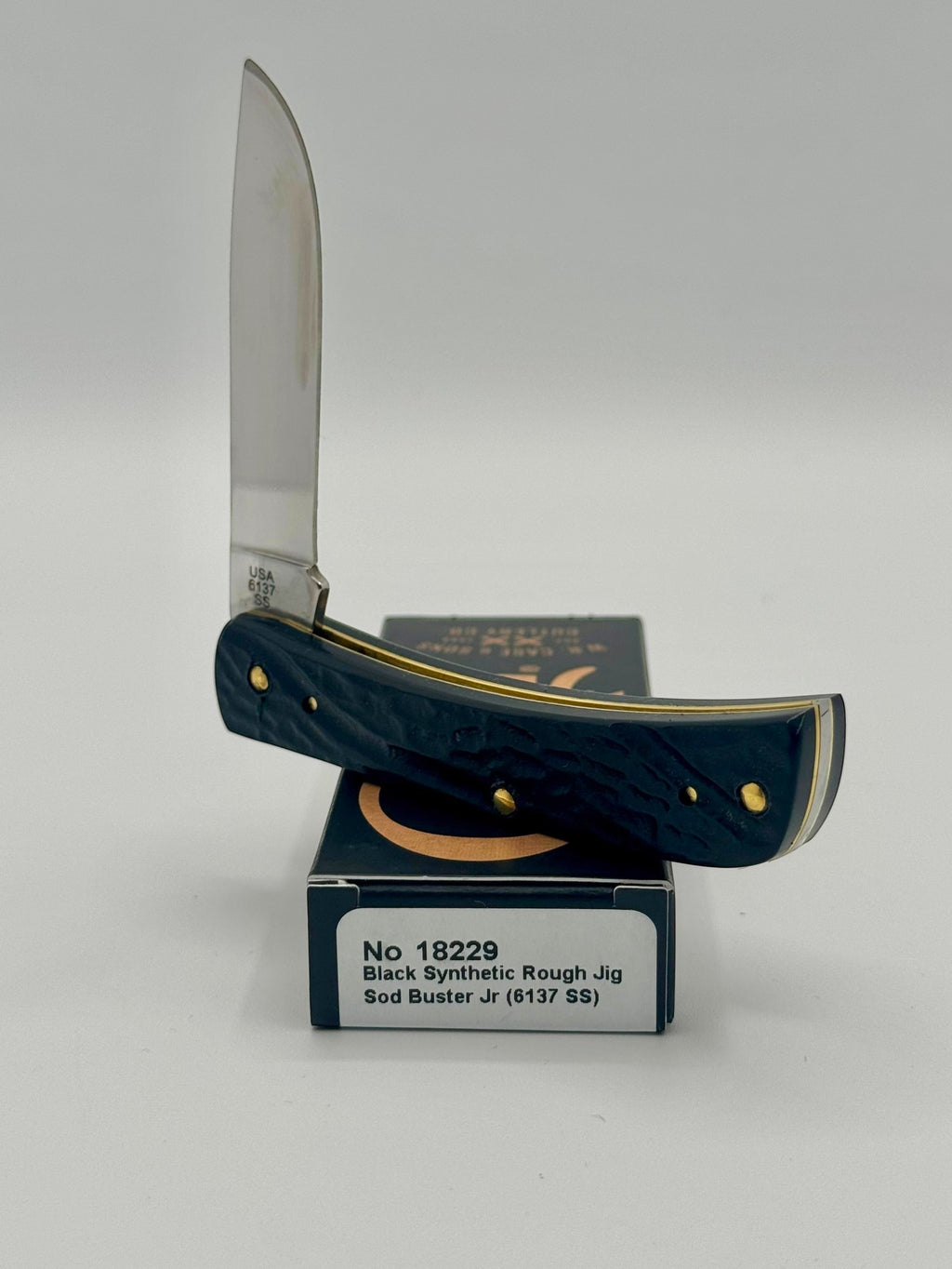 Case XX 18229 Rough Black Sod Buster Jr — handle and shield detail