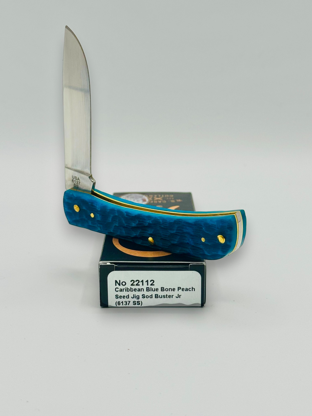 Case XX 22112 Sod Buster Jr Caribbean Blue Bone — handle and shield detail