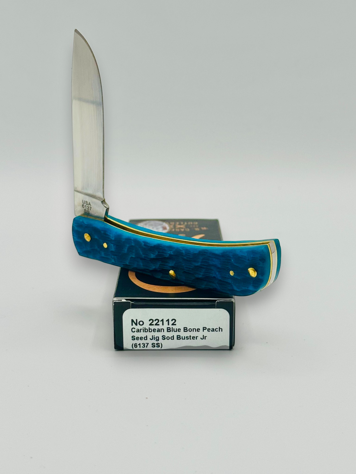 Case XX 22112 Sod Buster Jr Caribbean Blue Bone — handle and shield detail