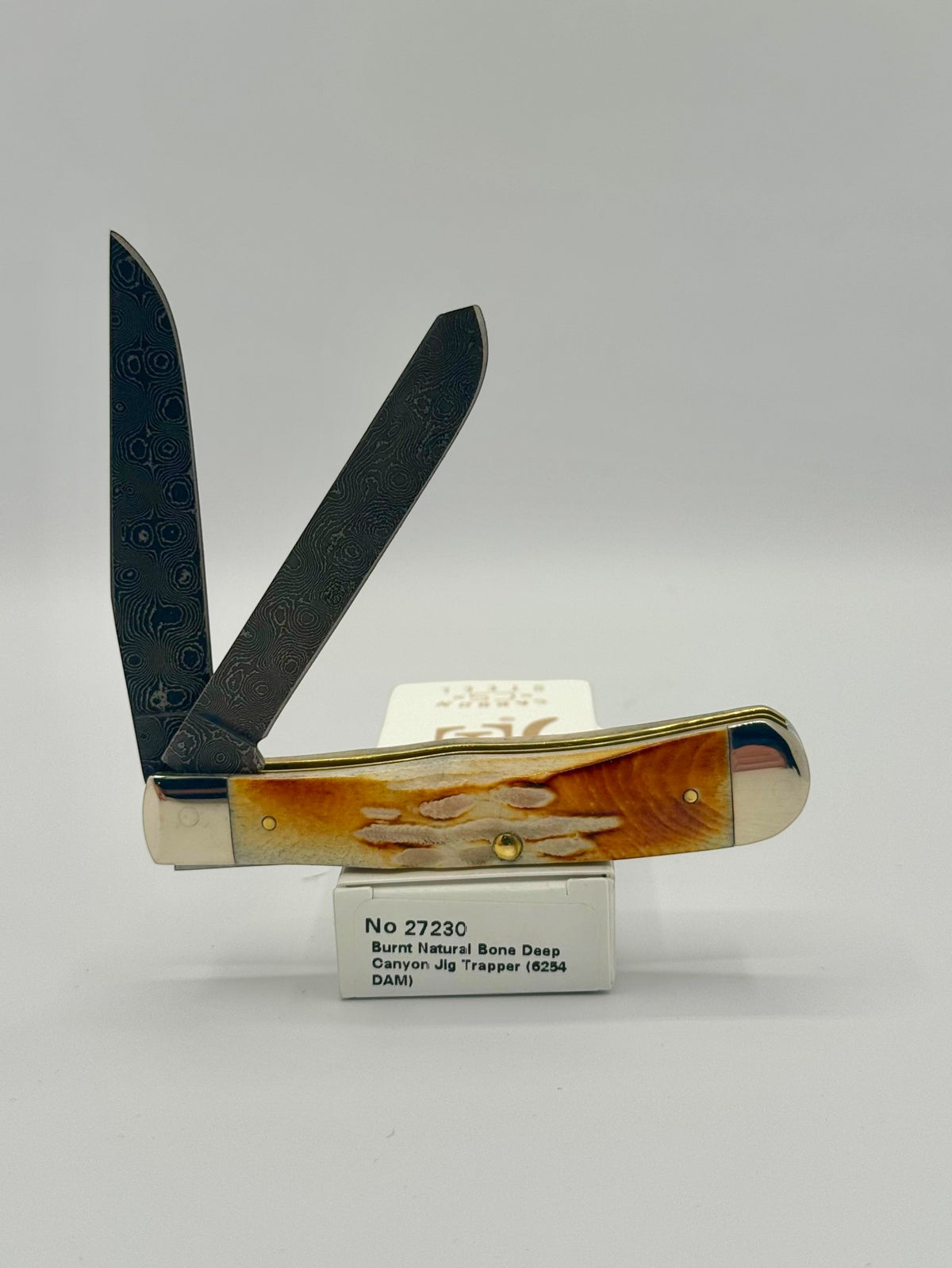 Case XX 27230 Damascus Burnt Natural Bone Deep Canyon Jig Trapper — angled open view