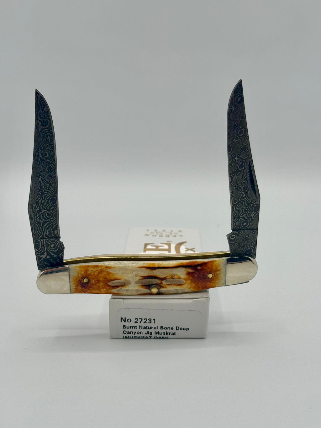 Case XX 27231 Damascus Burnt Natural Bone Deep Canyon Jig Muskrat — angled open view
