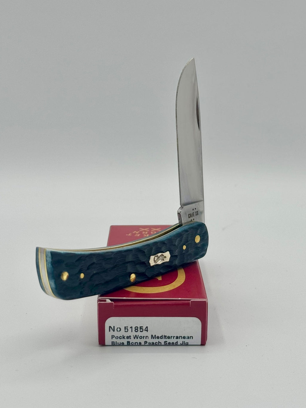 Case XX 51854 Mediterranean Blue Bone Sod Buster Jr — blade detail on Case box