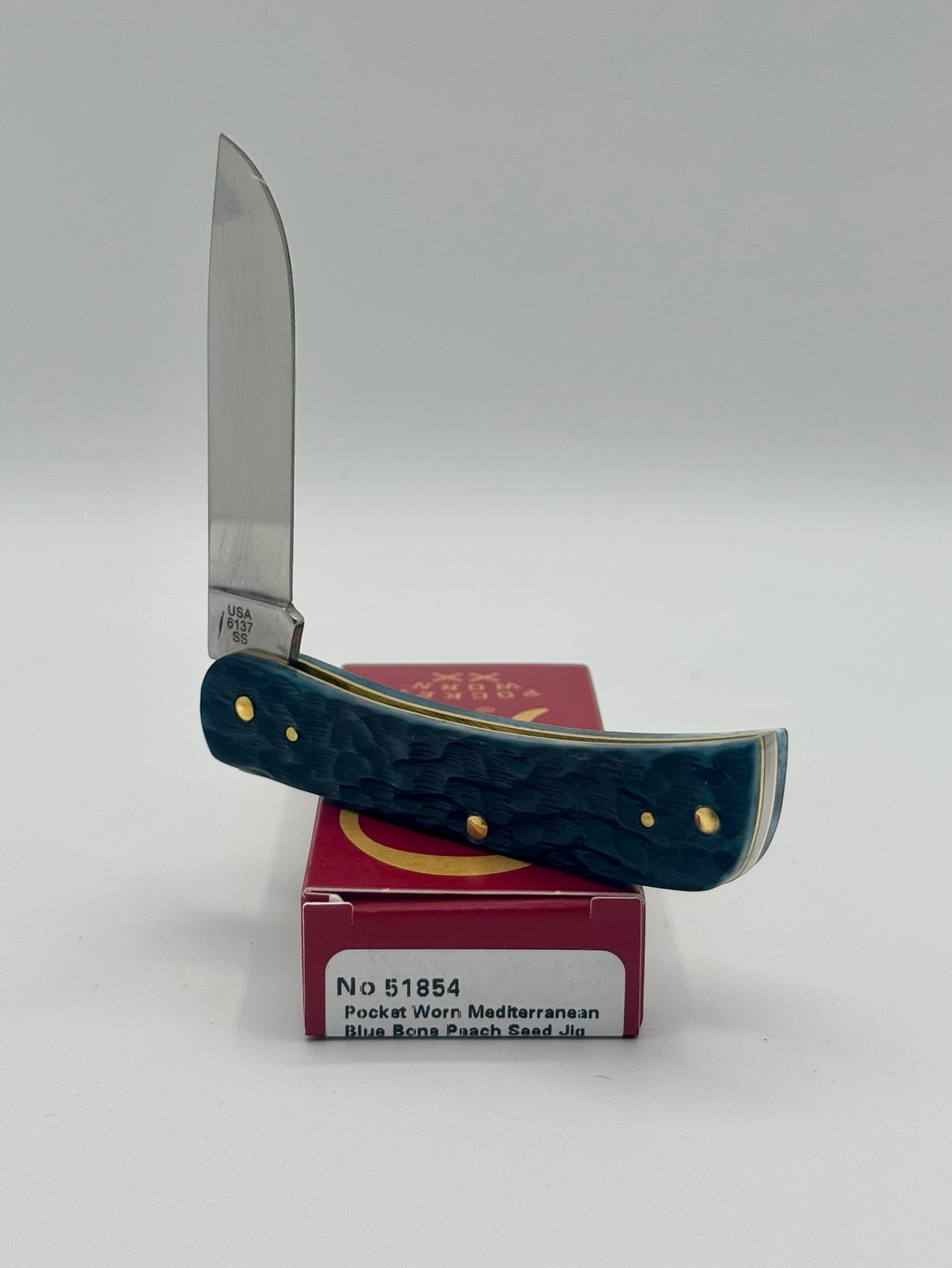 Case XX 51854 Mediterranean Blue Bone Sod Buster Jr — handle and shield detail