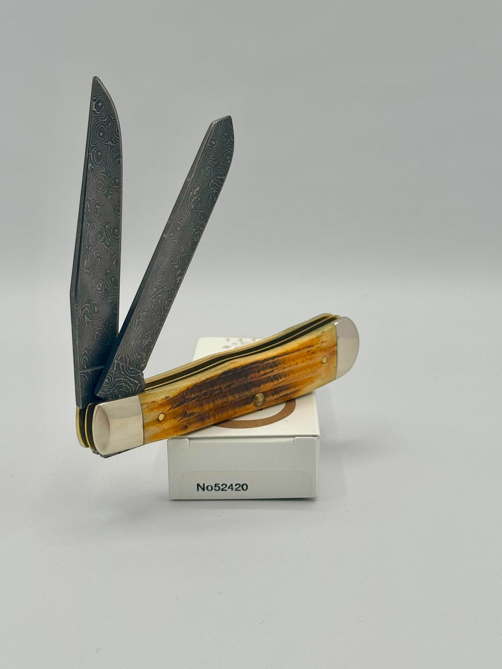 Case XX 52420 Burnt Goldenrod Second Cut Damascus Trapper — back side on Case box