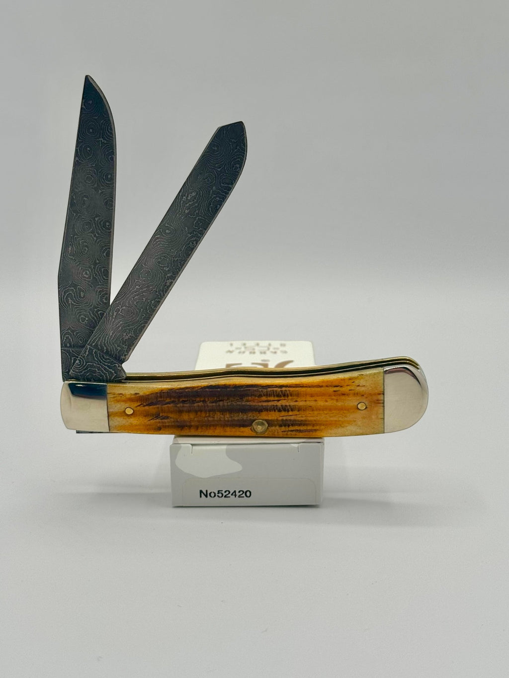 Case XX 52420 Burnt Goldenrod Second Cut Damascus Trapper — angled open view