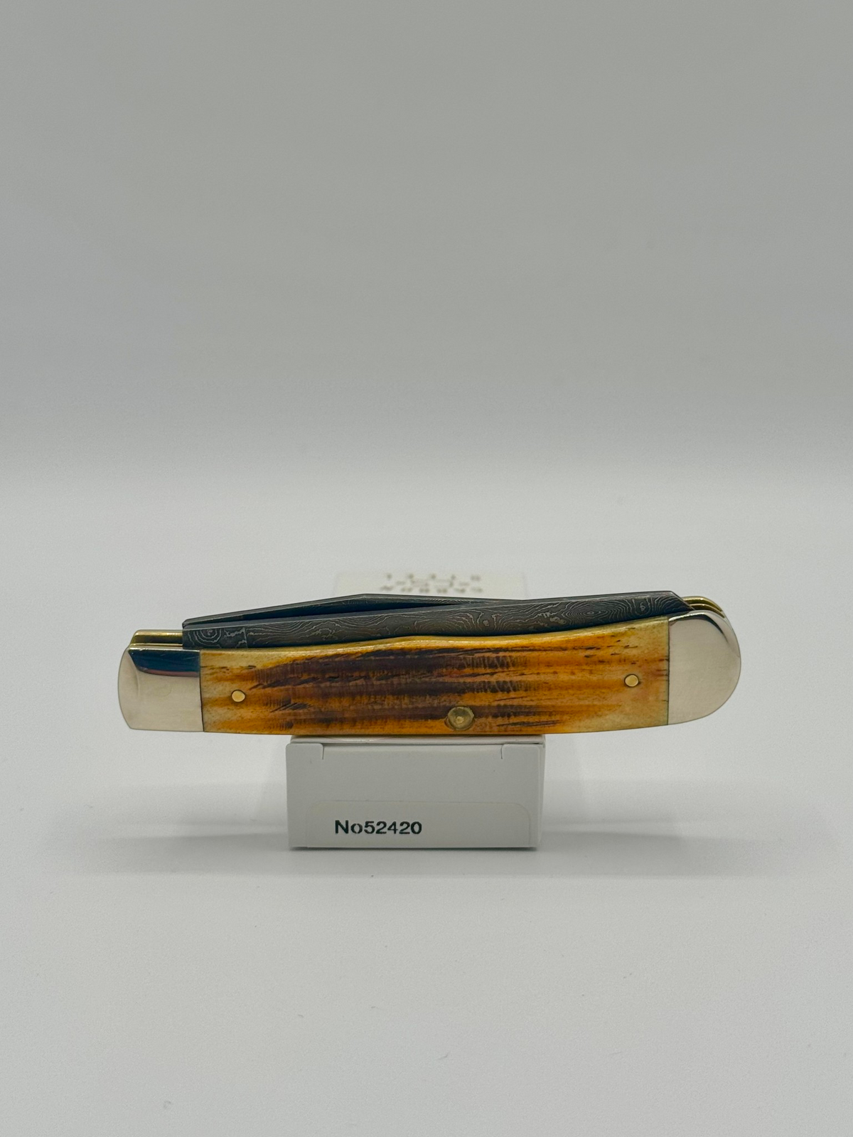 Case XX 52420 Burnt Goldenrod Second Cut Damascus Trapper — packaging and knife together