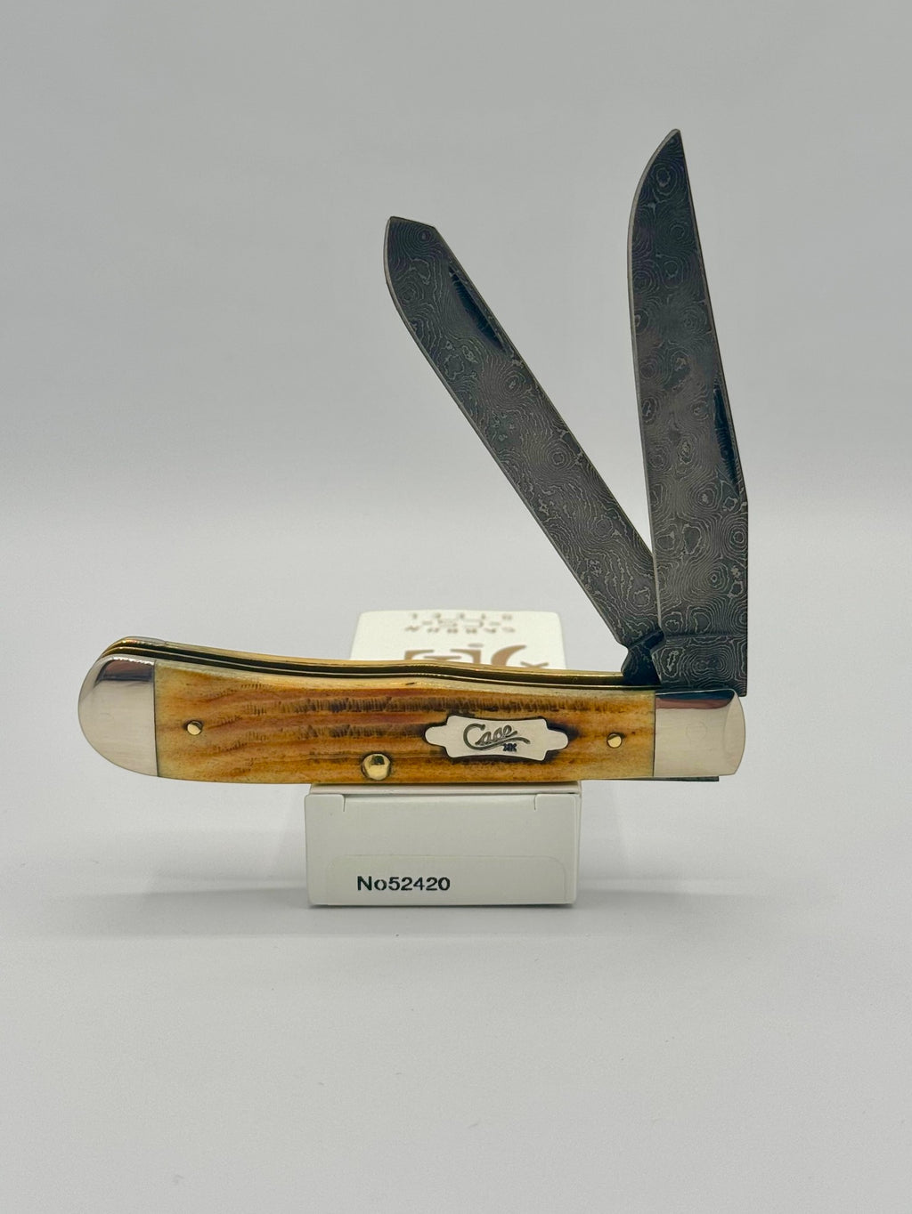 Case XX 52420 Burnt Goldenrod Second Cut Damascus Trapper — open on Case retail box