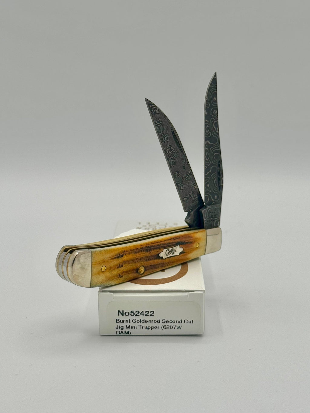 Case XX 52422 Burnt Goldenrod Second Cut Damascus Mini Trapper — blade detail on Case box