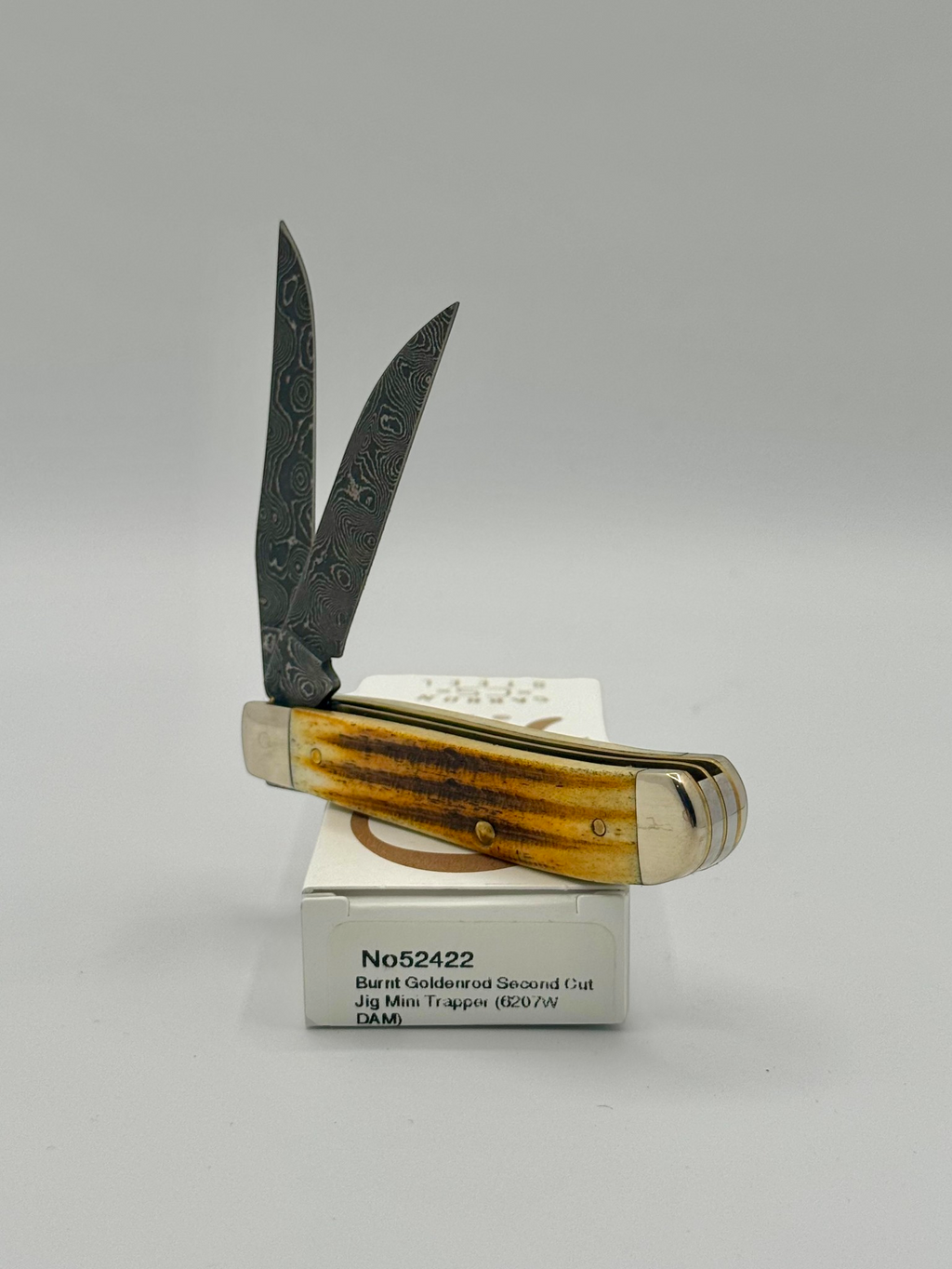 Case XX 52422 Burnt Goldenrod Second Cut Damascus Mini Trapper — handle and shield detail