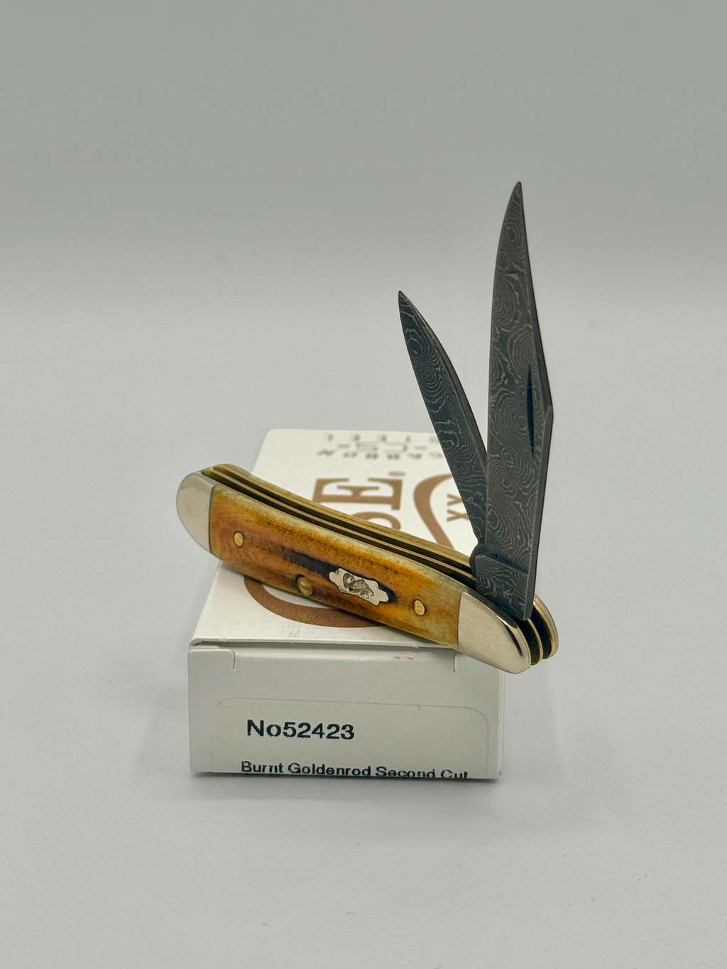 Case XX 52423 Burnt Goldenrod Second Cut Damascus Peanut — closed on Case box