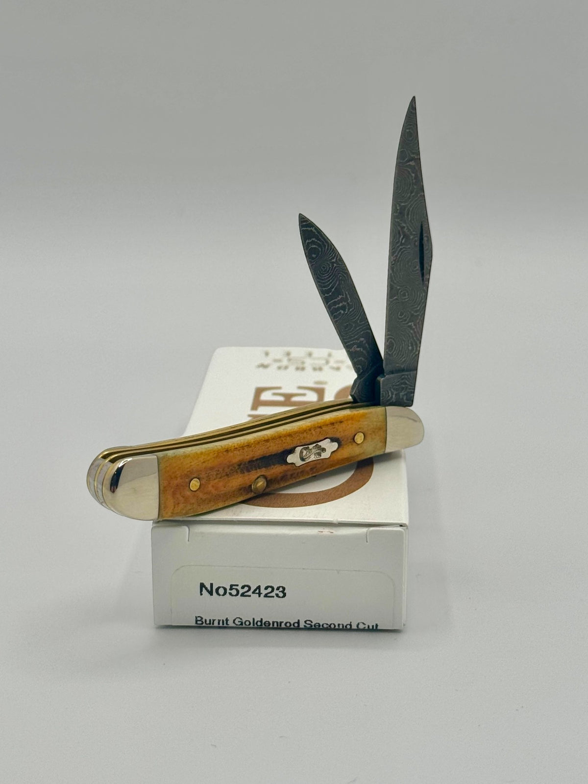Case XX 52423 Burnt Goldenrod Second Cut Damascus Peanut — blade detail on Case box