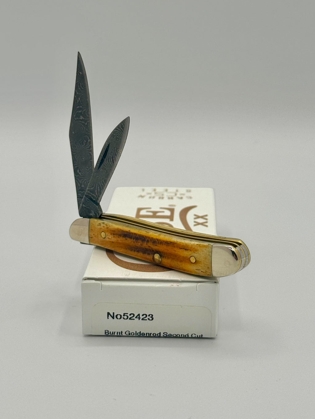 Case XX 52423 Burnt Goldenrod Second Cut Damascus Peanut — handle and shield detail