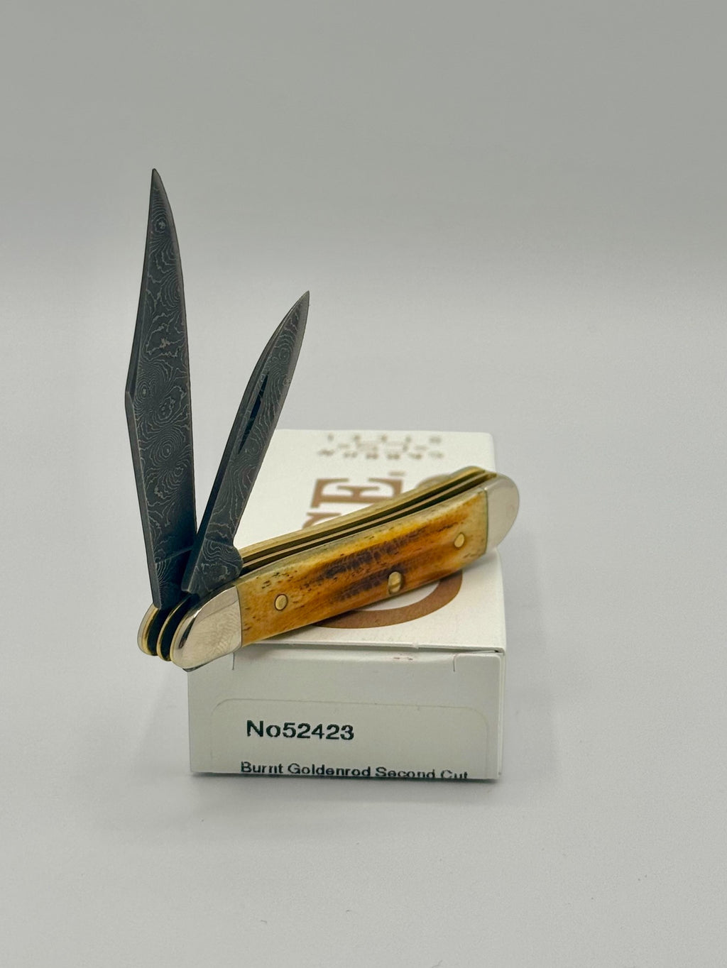 Case XX 52423 Burnt Goldenrod Second Cut Damascus Peanut — back side on Case box