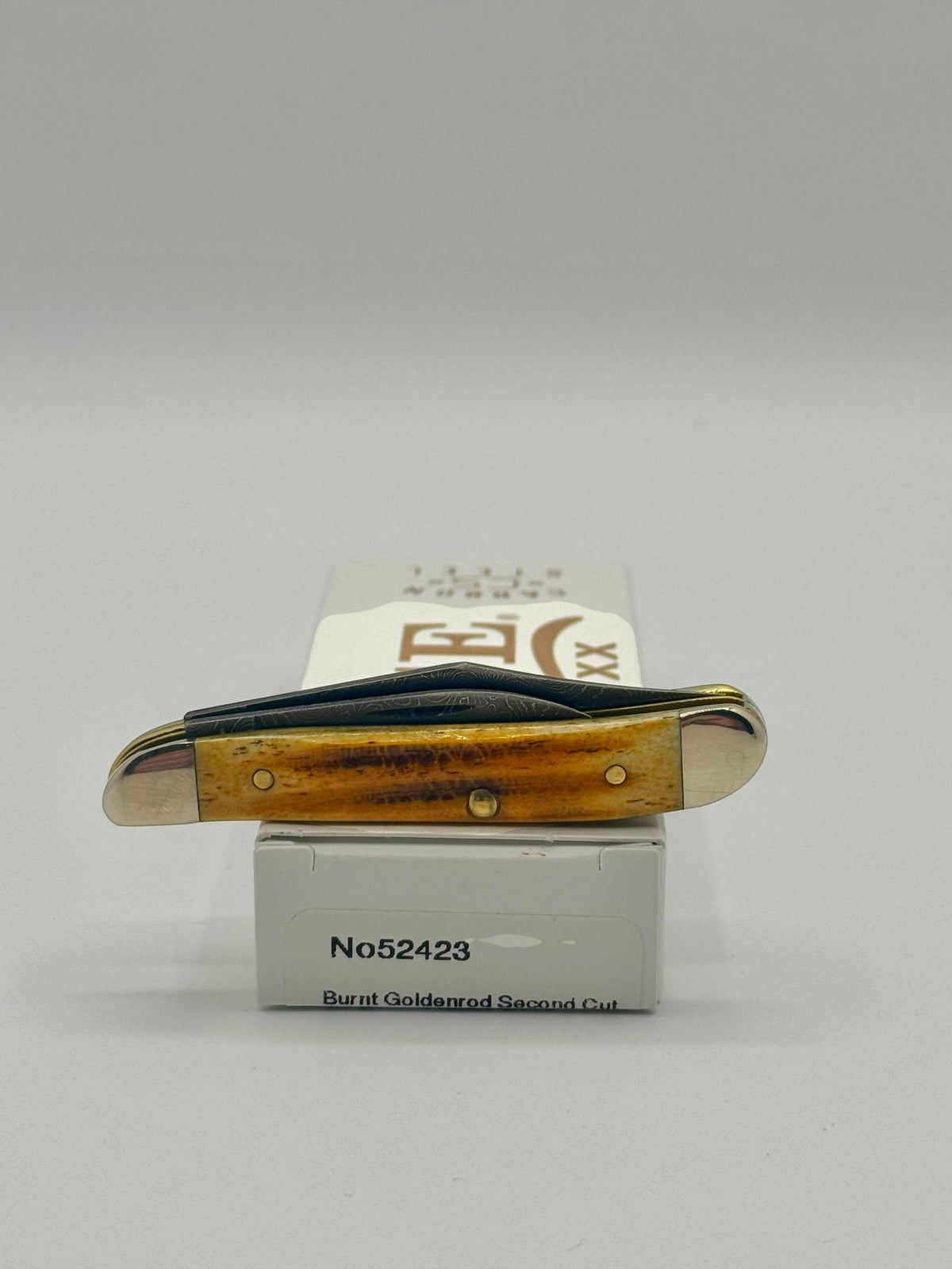 Case XX 52423 Burnt Goldenrod Second Cut Damascus Peanut — packaging and knife together