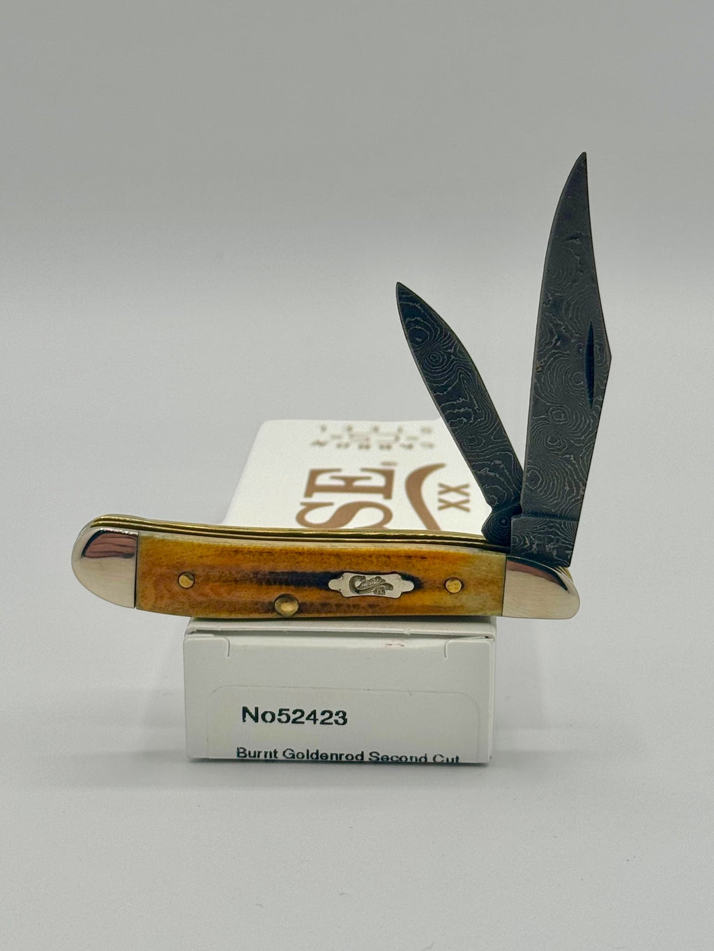 Case XX 52423 Burnt Goldenrod Second Cut Damascus Peanut — open on Case retail box